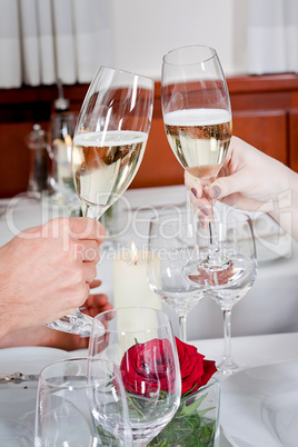 happy smiling couple in restaurant celebrate