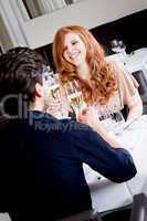 happy smiling couple in restaurant celebrate