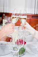 happy smiling couple in restaurant celebrate