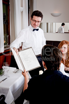 man and woman in restaurant for dinner