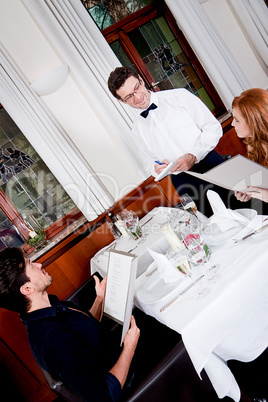 man and woman in restaurant for dinner