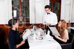 man and woman for dinner in restaurant