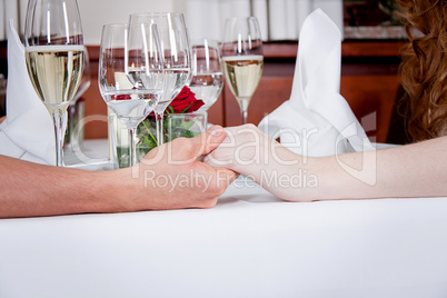 happy smiling couple in restaurant celebrate