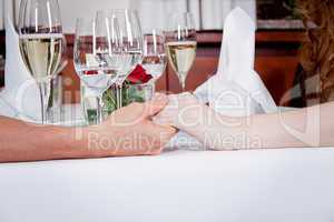 happy smiling couple in restaurant celebrate