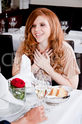 happy smiling couple in restaurant celebrate