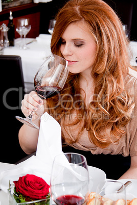 couple drinking red wine in restaurant