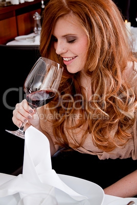 couple drinking red wine in restaurant