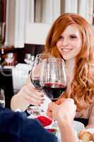 couple drinking red wine in restaurant