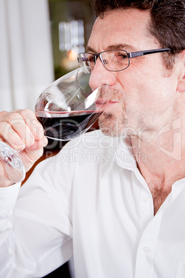 couple drinking red wine in restaurant