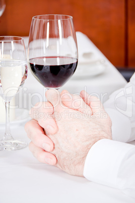 happy smiling couple in restaurant celebrate