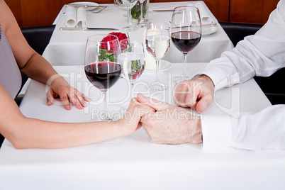 happy smiling couple in restaurant celebrate