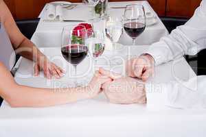 happy smiling couple in restaurant celebrate