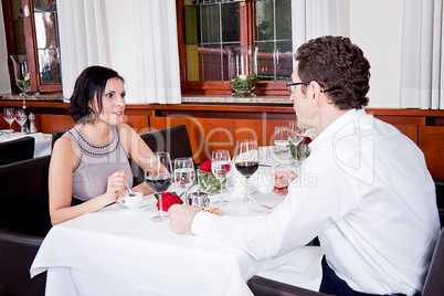 happy smiling couple in restaurant