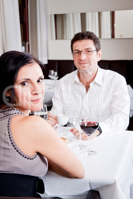 happy smiling couple in restaurant