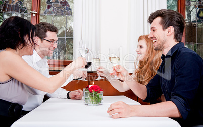 smiling happy people in restaurant