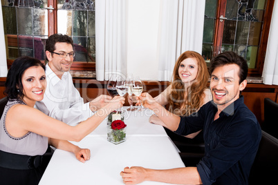 smiling happy people in restaurant