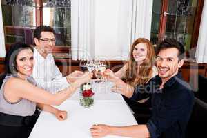 smiling happy people in restaurant