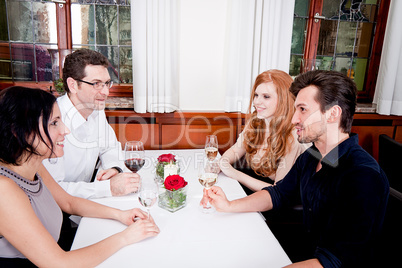 smiling happy people in restaurant