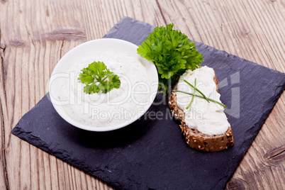 fresh tasty herbal creme cheese and bread