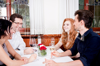 smiling happy people in restaurant