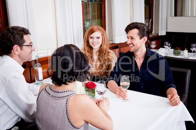 smiling happy people in restaurant