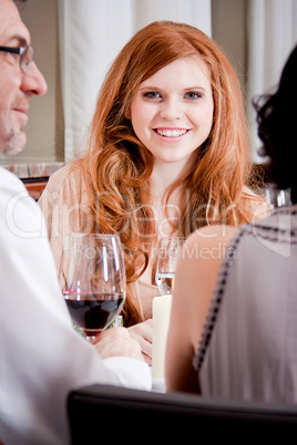 smiling happy people in restaurant