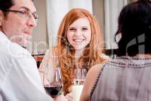 smiling happy people in restaurant