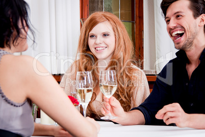 smiling happy people in restaurant