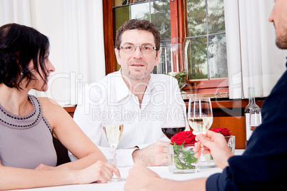 smiling happy people in restaurant