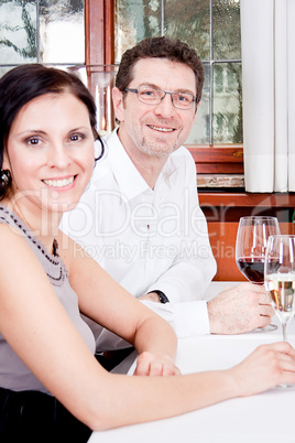 smiling happy people in restaurant