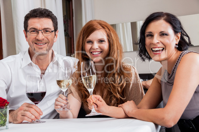 smiling happy people friends in restaurant