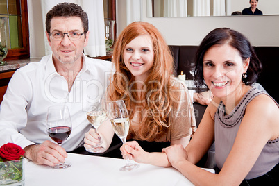 smiling happy people in restaurant