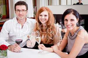 smiling happy people in restaurant