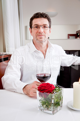 couple drinking red wine in restaurant