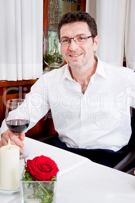 couple drinking red wine in restaurant