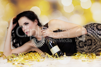 Beautiful young woman partying with champagne