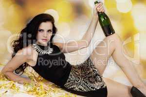 Beautiful young woman partying with champagne