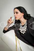 Seductive brunette holding a glass of champagne