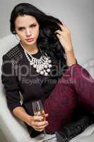 Seductive brunette holding a glass of champagne