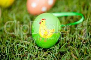 colored easter eggs group in green grass outdoor in spring