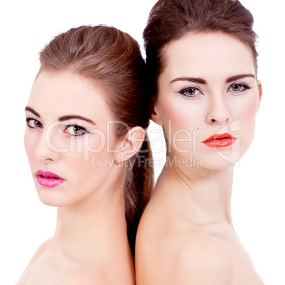 two beautiful girls with colorfull makeup isolated