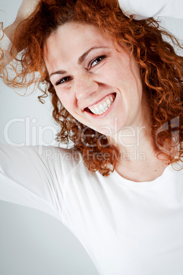 attractive young redhead woman smiling portrait