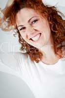 attractive young redhead woman smiling portrait