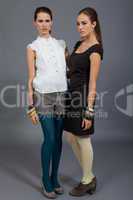 two beutiful brunette girls in casual fashion and accessory