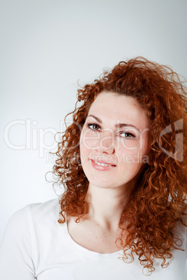 attractive young redhead woman smiling portrait