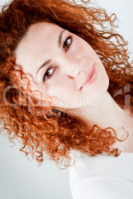 attractive young redhead woman smiling portrait