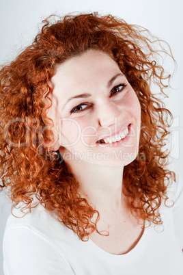 attractive young redhead woman smiling portrait