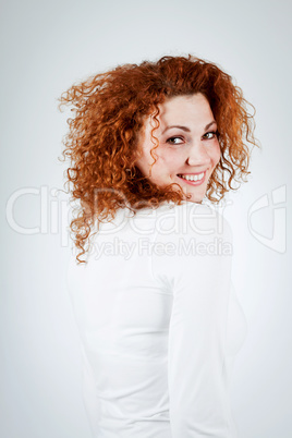 attractive young redhead woman smiling portrait