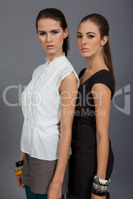 two beutiful brunette girls in casual fashion and accessory