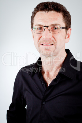 attractive adult man with glasses and black shirt